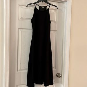 Two sleeveless polyester dresses, size large, red, and white $20 for both